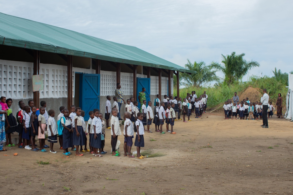 Children line up outside of their classrooms at Manua School near Kindu.